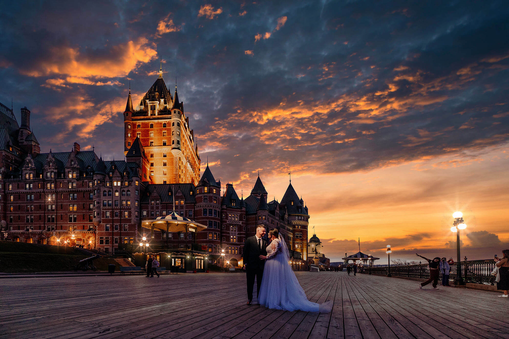 Couple in front of the Chateau Frontenac at sunset