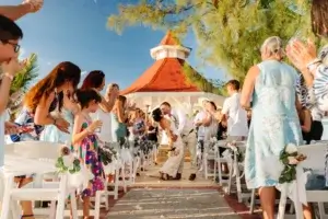The newlyweds exit under the tropical skies at the Bahia Principe Grand Jamaica gazebo.