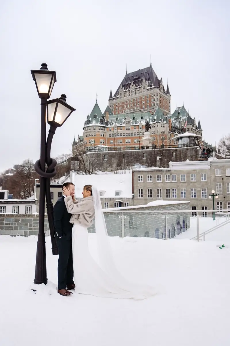 Bride and groom cuddling in the Montmorency park in Quebec City.