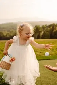 Little girl on te golf course at the Manoir Richelieu