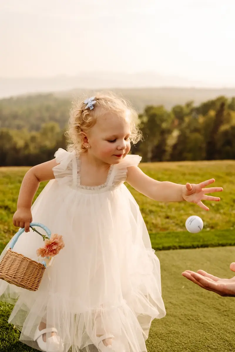 Little girl on te golf course at the Manoir Richelieu