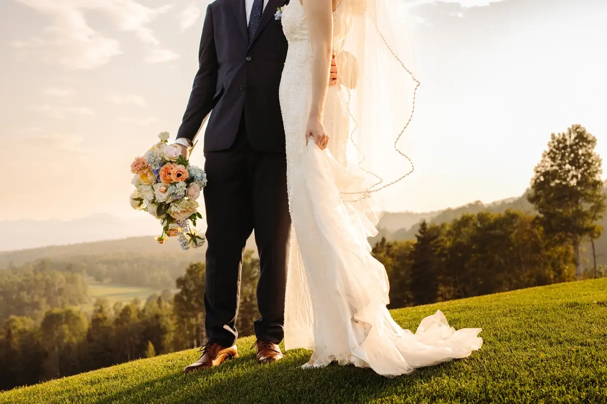 Bride and groom on the top of the hill at the Manoir Richelieu's golf course
