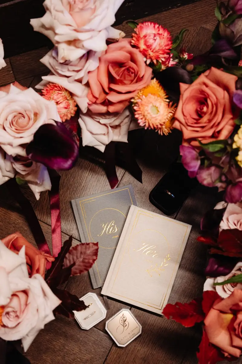 Flat lay Vows book HIS and HER