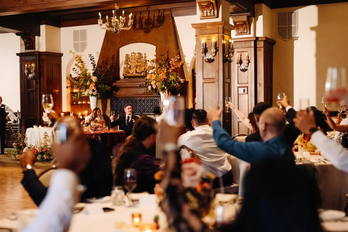 Wedding reception and people toasting in the Jacques-Cartier room at the Chateau Frontenac