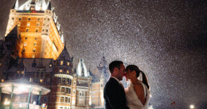Bride and groom in front of the Fairmont Chateau Frontenac