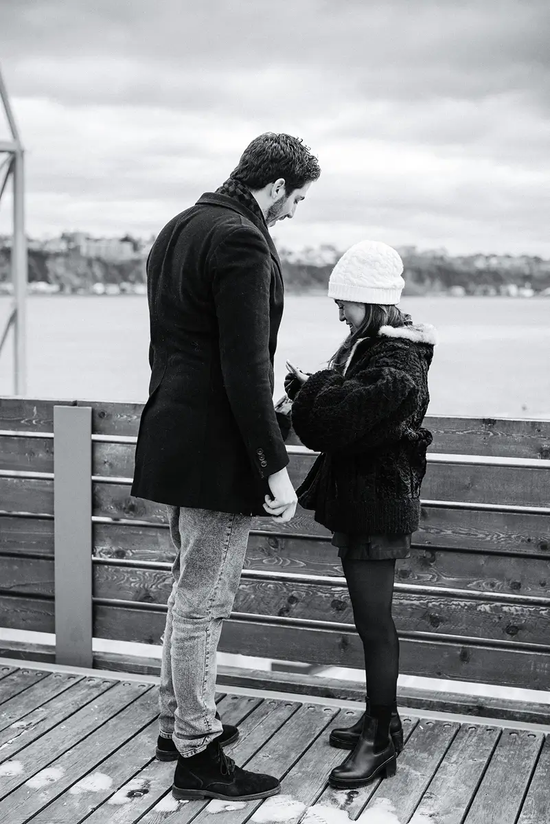moment following the proposal with a gril looking at here new ring