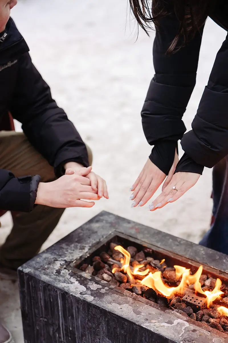 Couple fire pit and engagement ring