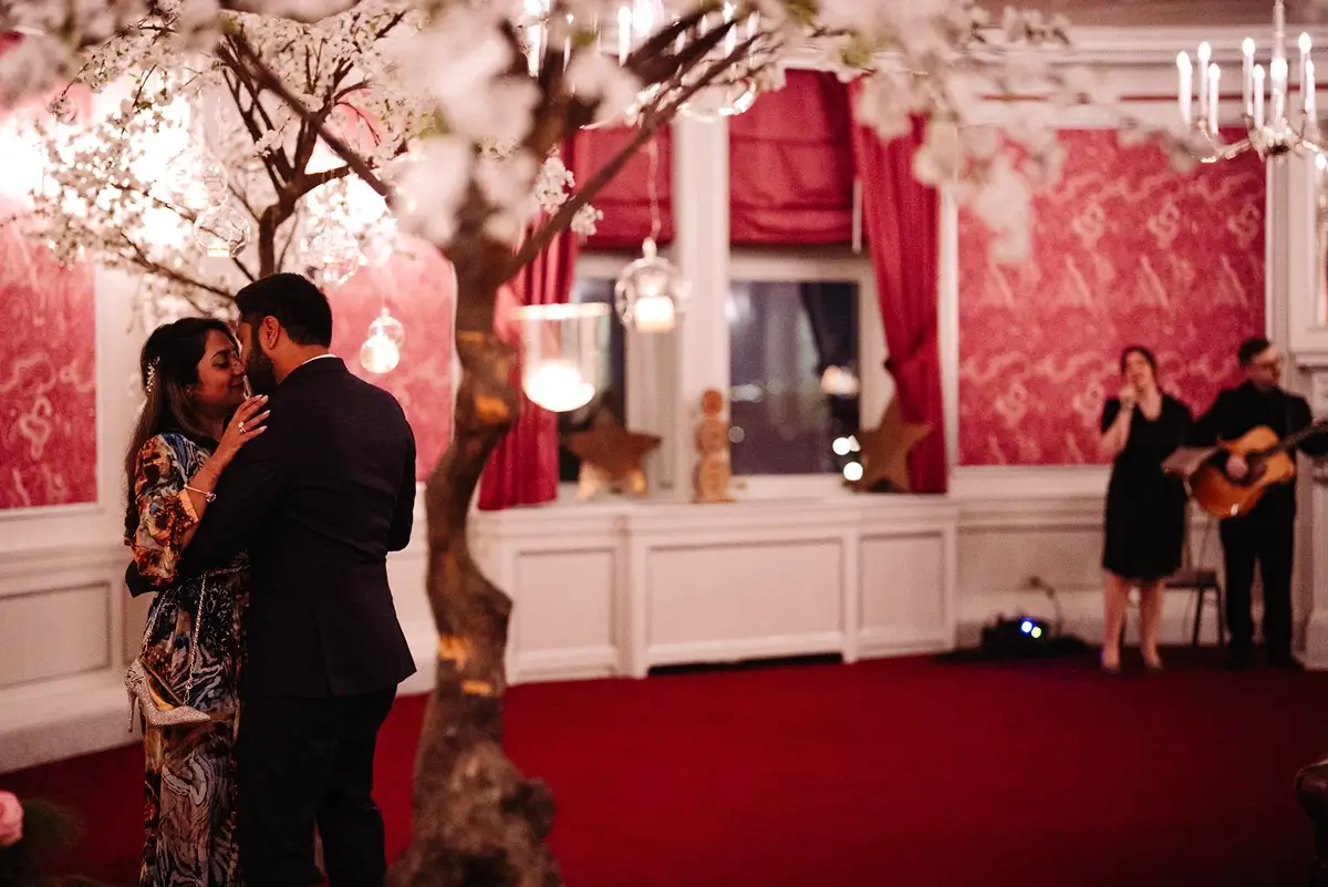 Couple dancing with musicians in the pink room at the Fairmont Chateau Frontenac