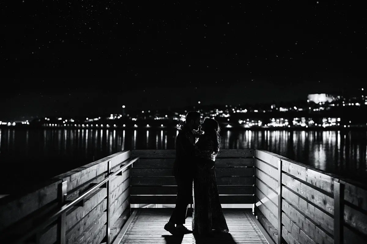 silhouette of a new engaged couple at night