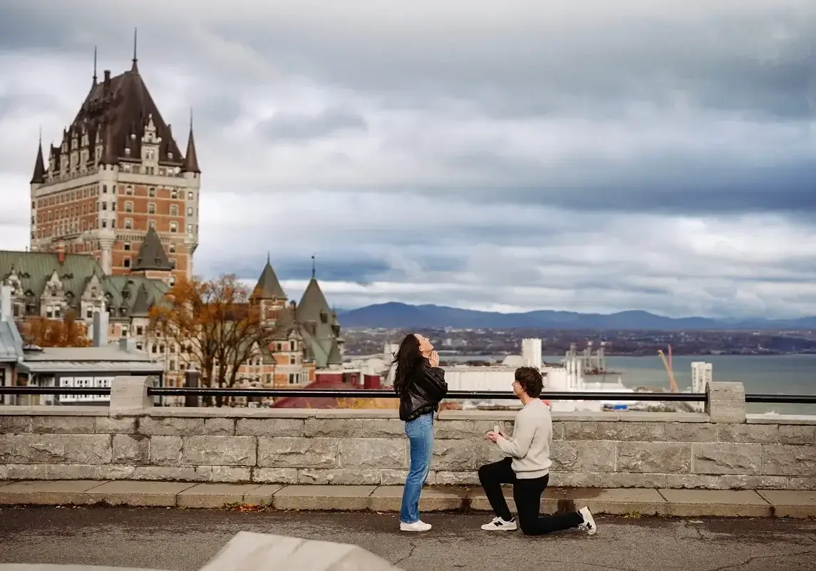 Proposal with a box and a ring. The girl is so excited.